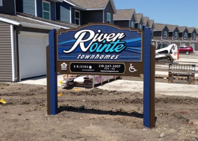 close up of custom sign for River Pointe Townhomes