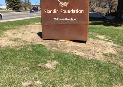 lighted sign on grassy patch for the Blandin Foundation