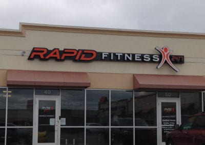 Rapid Fitness gym lighted sign on building