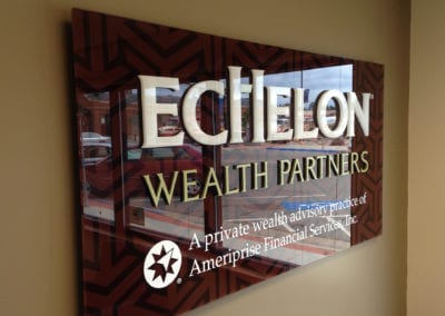 ADA interior sign on a beige wall advertising Echelon Wealth Partners