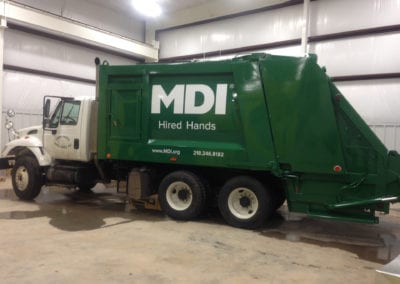 vinyl vehicle sign on white dump truck with green trailer for MDI Hired Hads
