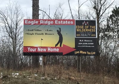 vinyl sign advertising Egle Ridge Estates showing a man golfing