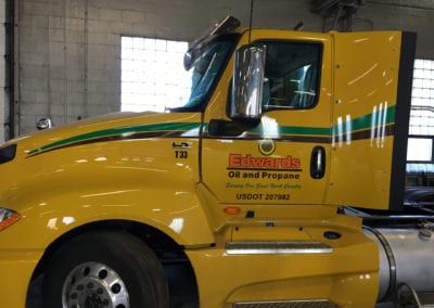 vinyl sign on yellow semi truck for Edwards Oil and Propane.